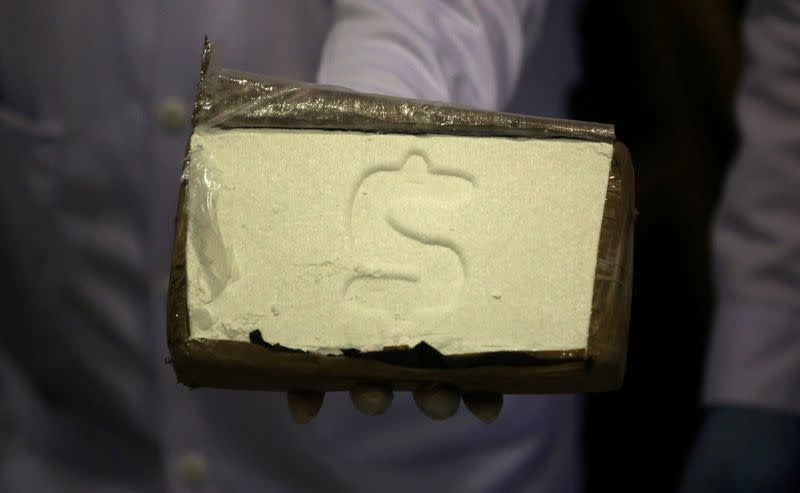 FILE PHOTO: A cocaine brick seized during an operation is displayed to the media at the Peruvian police headquarters in Lima