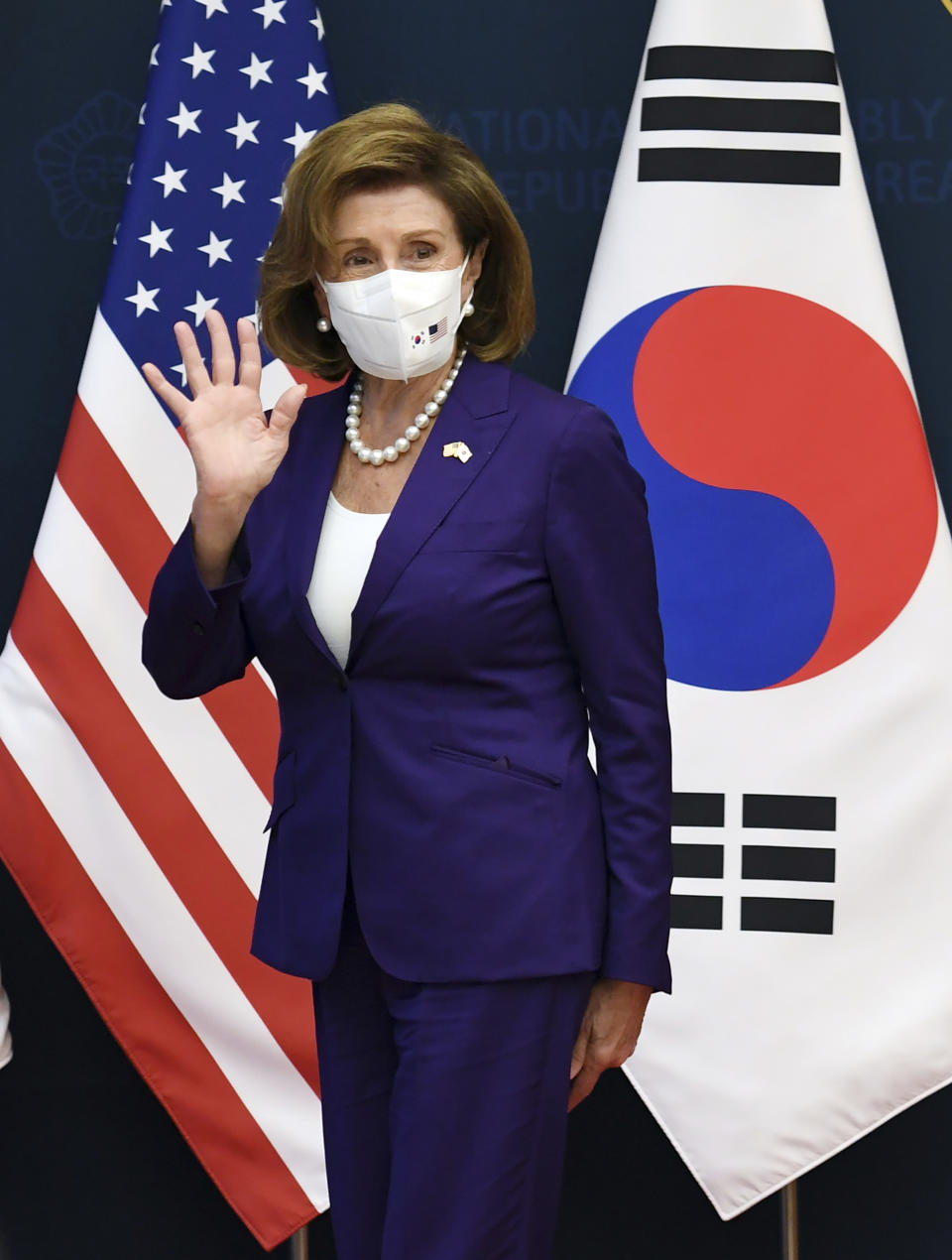 U.S. House Speaker Nancy Pelosi waves to media after a joint press announcement with South Korean National Assembly Speaker Kim Jin Pyo at the National Assembly in Seoul, Thursday, Aug. 4, 2022. (Kim Min-Hee/Pool Photo via AP)
