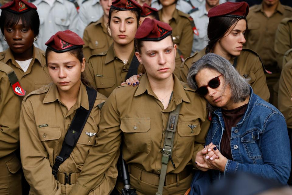 Mourners attend a funeral for Israel Defense Forces Sgt. David Sassoon on March 7, 2024, in Netanya, Israel.