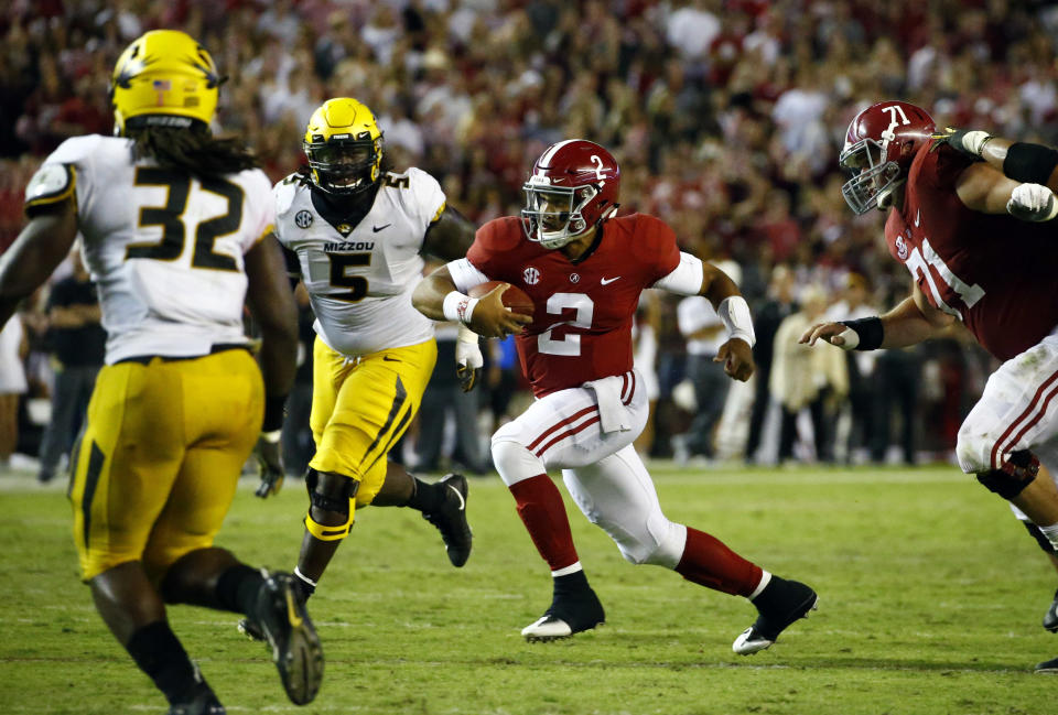 Alabama quarterback Jalen Hurts (2) scrambles for a first down during the second half of an NCAA college football game against Missouri, Saturday, Oct. 13, 2018, in Tuscaloosa, Ala. Alabama won 39-10. (AP Photo/Butch Dill)
