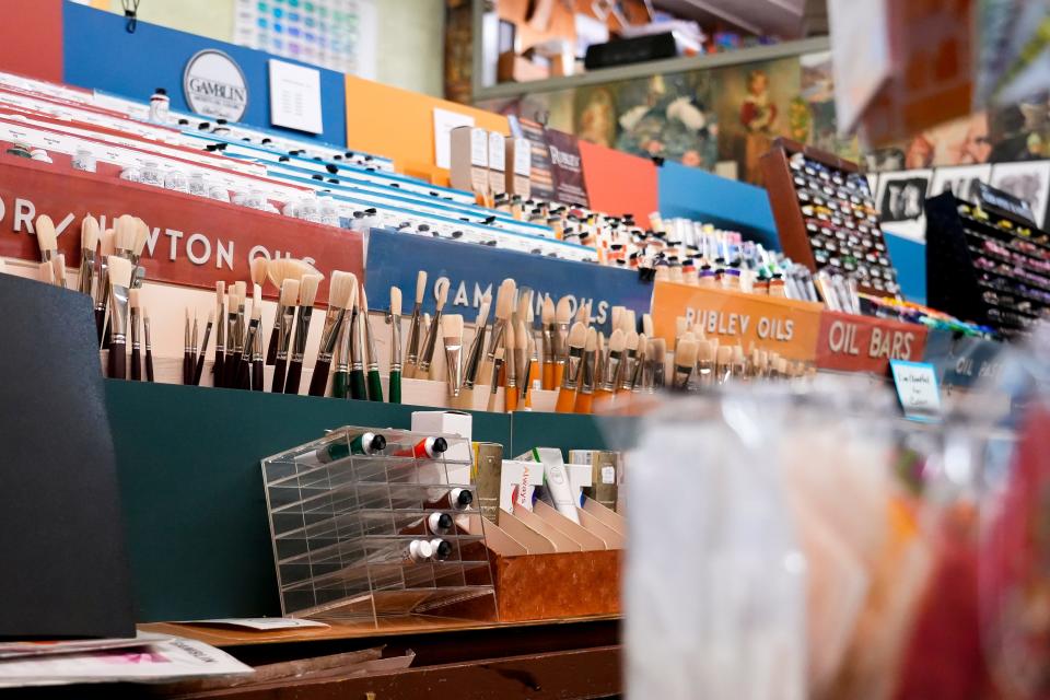 A variation of different brushes sit next to oil paints and origami paper on Tuesday, Jan. 16, 2024, at Suder’s Art Store in Over-the-Rhine.