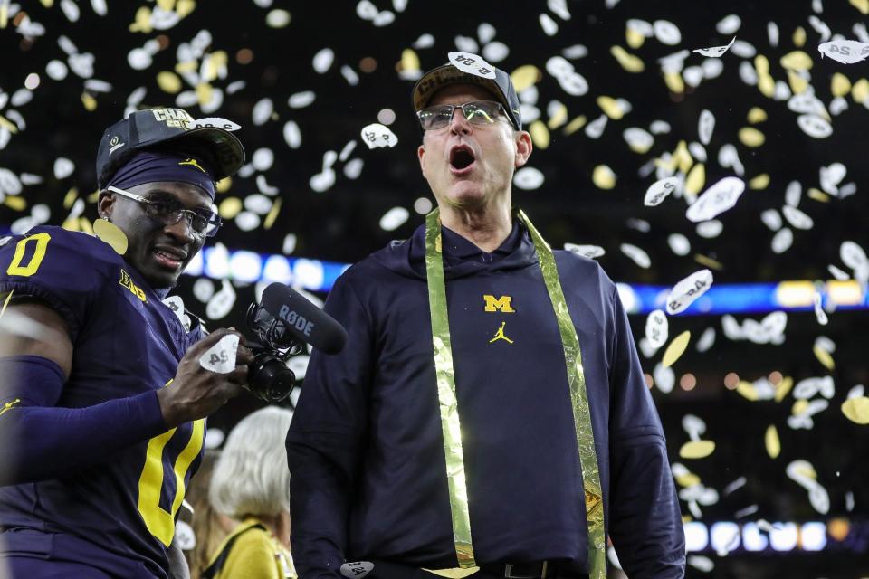 Michigan head coach Jim Harbaugh celebrates during the trophy presentation after the 34-13 win over Washington at the national championship game at NRG Stadium in Houston on Monday, Jan. 8, 2024.