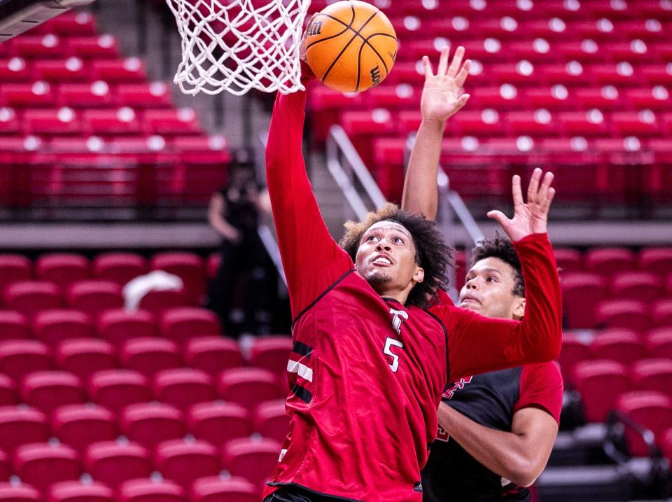 Darrion Williams finishes at the rim against Eemeli Yalaho during Texas Tech basketball practice, Thursday, September 26, 2024, in United Supermarkets Arena.