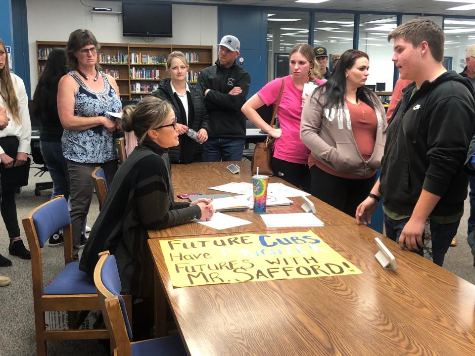 Anderson Union High School District Board of Trustees Member Jackie LaBarbera (left) speaks to residents and students after a heated engage surrounding the recent transfer of former Anderson High School principal Thomas Safford on Tuesday, April 18, 2023.