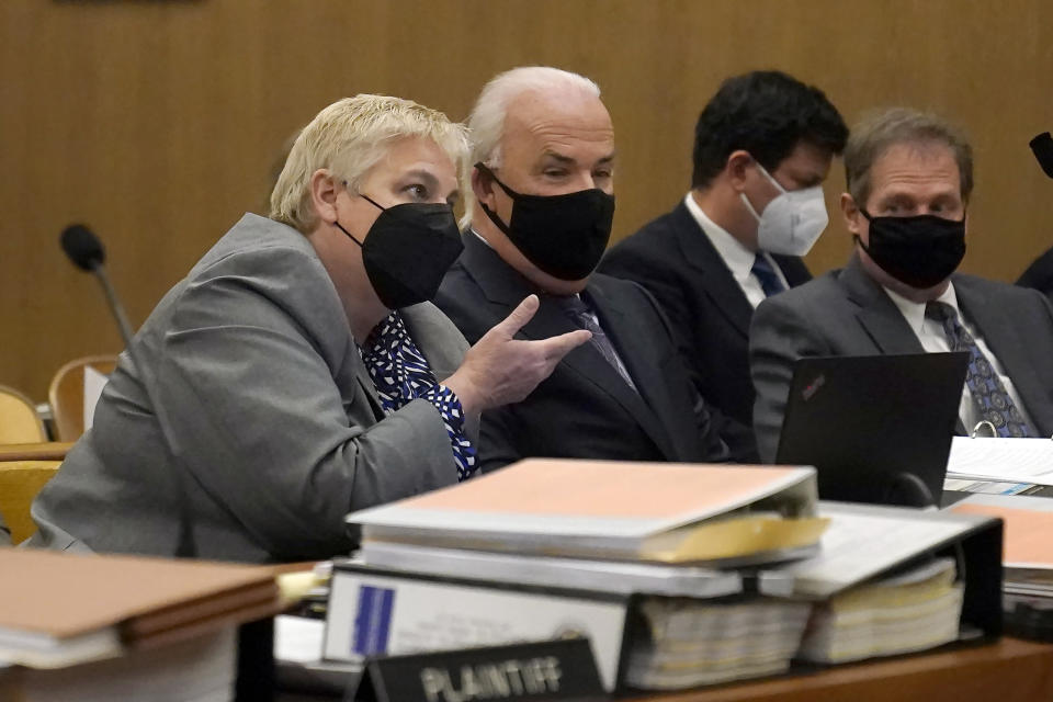 Shelley Sandusky, from left, speaks next to Pat Harris and Cliff Gardner, all attorneys representing Scott Peterson, during a hearing during a hearing at the San Mateo County Superior Court in Redwood City, Calif., Tuesday, March 1, 2022. Lawyers trying to overturn Peterson’s conviction in the slaying of his pregnant wife 20 years ago have completed their questioning without shaking a former juror. Richelle Nice is sticking to her crucial testimony that she acted properly before and during his 2004 trial. (AP Photo/Jeff Chiu, Pool)