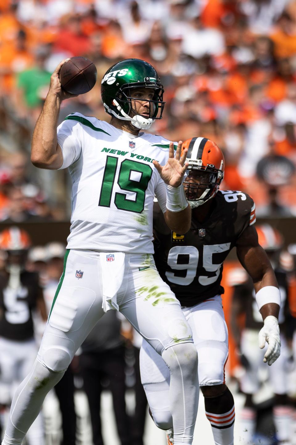 Sep 18, 2022; Cleveland, Ohio, USA; New York Jets quarterback Joe Flacco (19) throws the ball as Cleveland Browns defensive end Myles Garrett (95) hits him from behind during the second quarter at FirstEnergy Stadium. Mandatory Credit: Scott Galvin-USA TODAY Sports