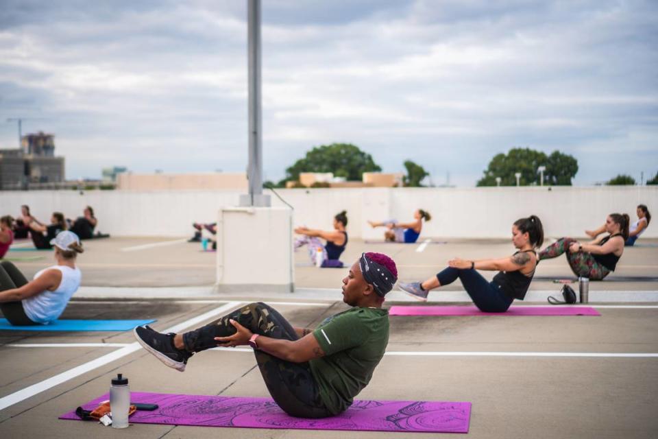 Sweatnet hosts outdoor group fitness workouts, such as this rooftop Pure Barre class.