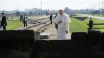 Pope Francis prays at the International Monument to the Victims of the Birkenau Nazi death camp on July 29, 2016 in Brzezinka