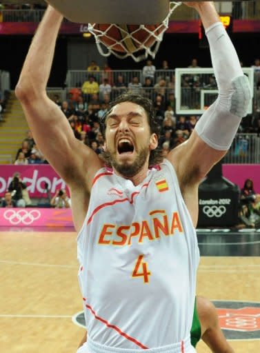 Spanish forward Pau Gasol scores during the men's basketball preliminary round match Spain vs Brazil as part of the London 2012 Olympic Games at the Basketball Arena in London. Brazil defeated Spain 88-82