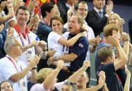 <p>What better way to spend a summer day than at the Olympics? The Duke and Duchess of Cambridge celebrate a gold win and a new world record for the men's sprint cycling team on day six of the London games. </p>