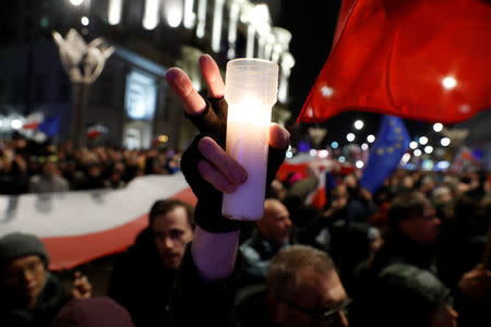 People gather in front of the Presidential Palace during a protest against judicial reforms in Warsaw, Poland, November 24, 2017. REUTERS/Kacper Pempel