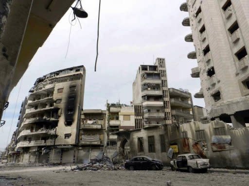 A handout picture released by Shaam News Network shows the destruction of buildings and vehicles in the restive city of Homs on April 14. The first international observers tasked with monitoring a shaky UN-backed ceasefire in Syria have arrived in Damascus, a United Nations spokesman said Sunday