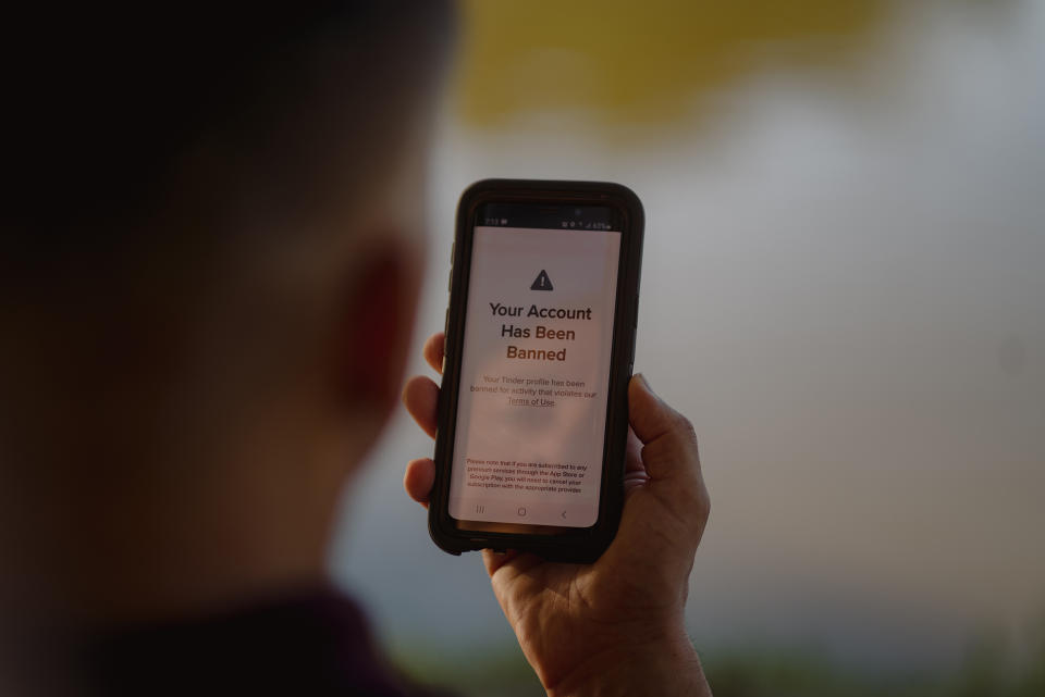 Image: Hand holding a phone that reads,