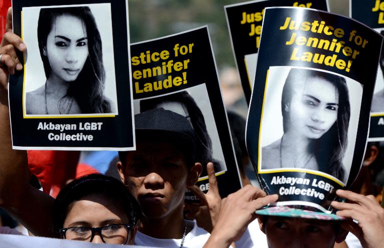 Supporters hold up posters of transgender Filipina Jennifer Laude during a protest near the courthouse in Olongapo City, Philippines, on February 23, 2015