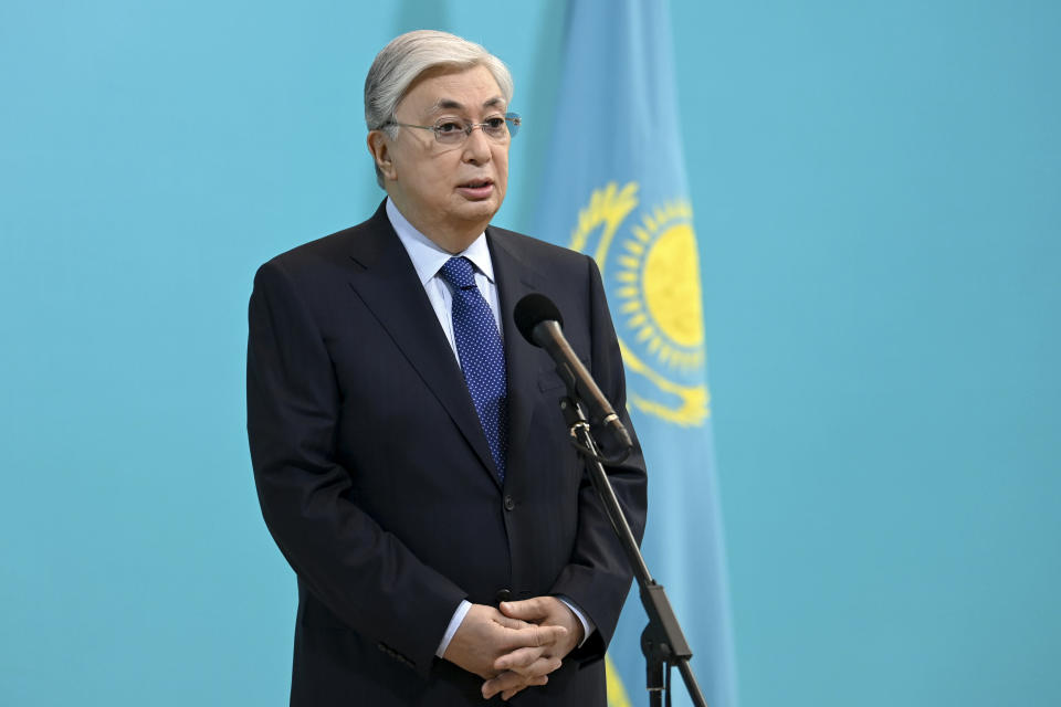 In this photo released by Kazakhstan's Presidential Press Service, Kazakhstan's President Kassym-Jomart Tokayev speaks to the media after voting at a polling station in the Al-Farabi Schoolchildren Palace during the Nationwide Referendum in Nur-Sultan, Kazakhstan, Sunday, June 5, 2022. Kazakhs vote on a package of reforms intended to transform the country from a super-presidential system to a "presidential system with a strong parliament." (Kazakhstan's Presidential Press Service via AP)