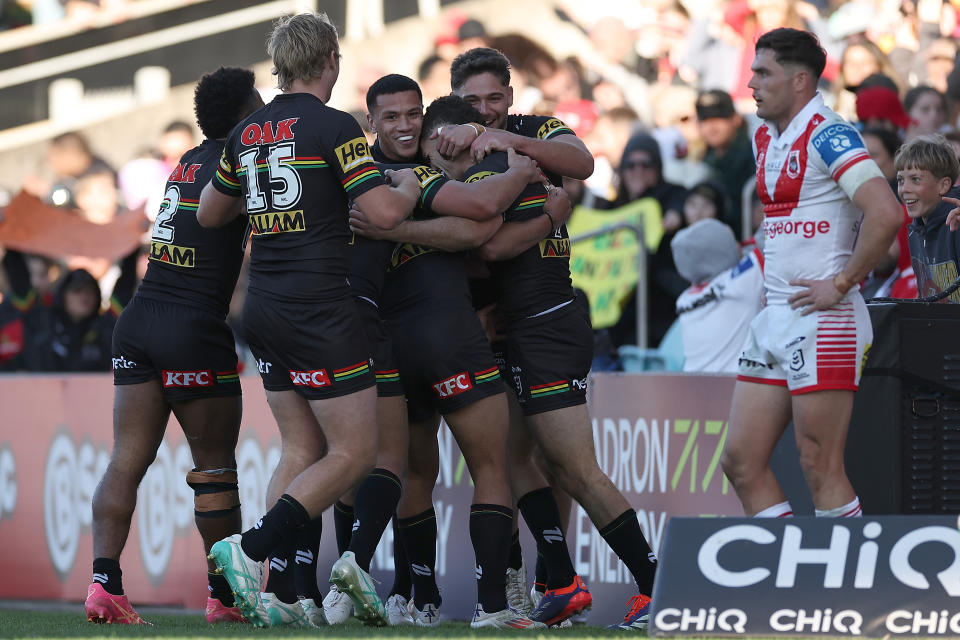 WOLLONGONG, AUSTRALIA - JULY 28: Nathan Cleary scores a hat-trick of tries and celebrates with his teammates during the round 21 NRL match between St George Illawarra Dragons and Penrith Panthers at WIN Stadium, on July 28, 2024, in Wollongong, Australia. (Photo by Jeremy Ng/Getty Images)