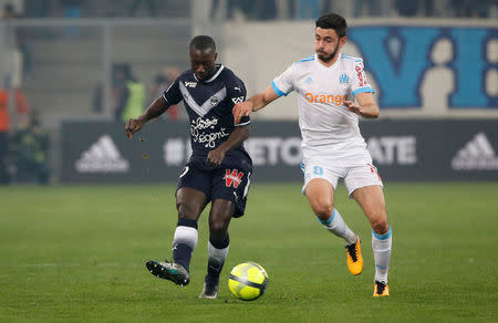 Soccer Football - Ligue 1 - Olympique de Marseille vs Bordeaux - Orange Velodrome, Marseille, France - February 18, 2018 Marseille's Morgan Sanson in action with Bordeaux's Youssouf Sabaly REUTERS/Jean-Paul Pelissier