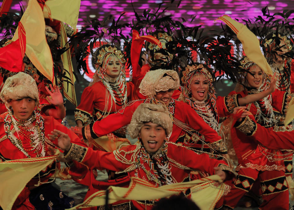 Performers dance in a night parade to celebrate Chinese New Year in Hong Kong, Saturday, Jan. 28, 2017. The Lunar New Year this year marks the Year of the Rooster in the Chinese calendar. (AP Photo/Vincent Yu)