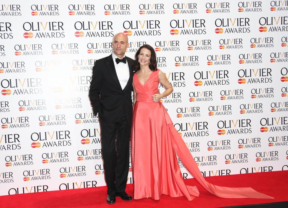 British actor Mark Strong and US actress Kristin Davis pose for photographs backstage after presenting Best Director to Lyndsey Turner during the Olivier Awards at the Royal Opera House in central London, Sunday, April 13, 2014. Named after the British actor Laurence Olivier, the awards are given for productions staged in London. (Photo by Joel Ryan/Invision/AP Images)