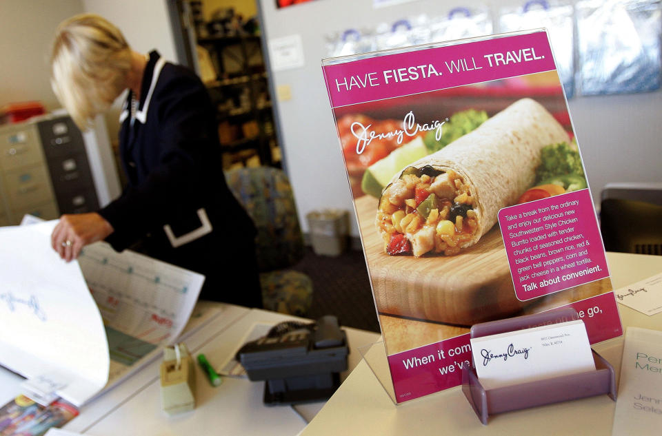 Area market director Jeri Dawn Martel looks over the scheduling book at a Jenny Craig facility in Niles, Ill. (Tim Boyle / Getty Images file )