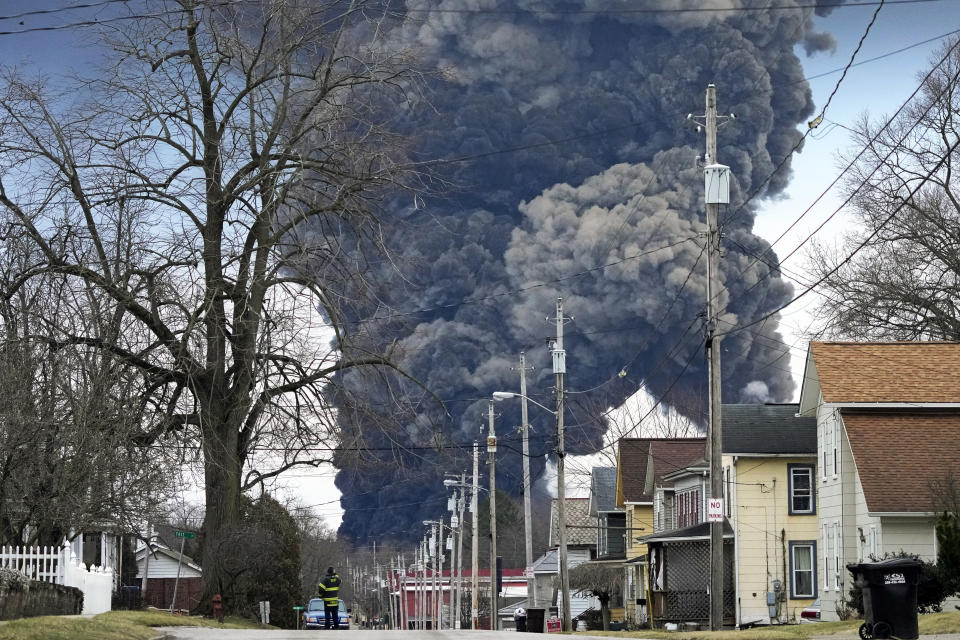 FILE - A black plume rises over East Palestine, Ohio, as a result of the controlled detonation of a portion of the derailed Norfolk Southern trains, Feb. 6, 2023. The Internal Revenue Service decided Wednesday, June 5, 2024, that most people who received money from Norfolk Southern in the wake of the train derailment won't have to pay taxes on millions of dollars in aid payments. (AP Photo/Gene J. Puskar, File)