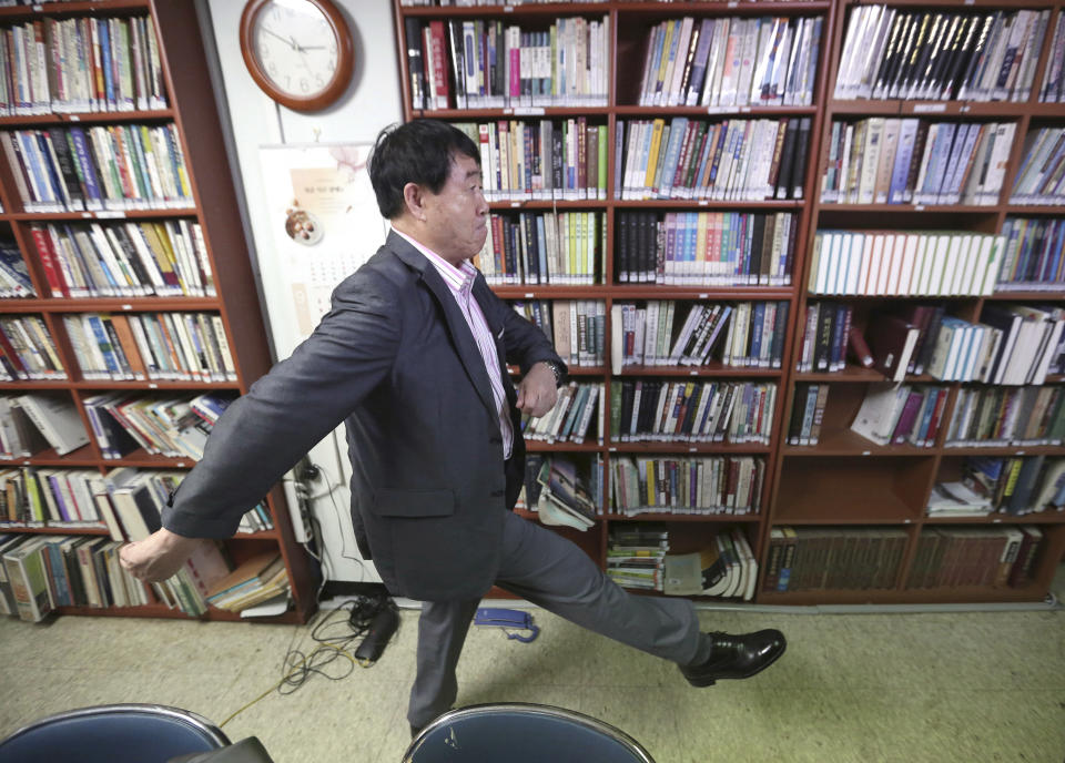 In this Aug. 29, 2018 photo, North Korean defector Sim Ju-il shows how to do North Korean military goosesteps during an interview in Seoul, South Korea. Even two decades after he fled North Korea, even with an abiding hatred of the ruling dictatorship, Sim sometimes still relives the days when he goose-stepped past the nation’s revered founder, Kim Il Sung, as a young man. Goose-stepping soldiers are the most spectacular part of North Korea’s massive military parades. (AP Photo/Ahn Young-joon)