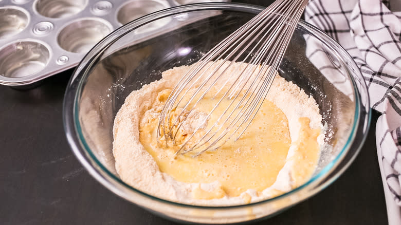 Mixing muffin batter in glass bowl