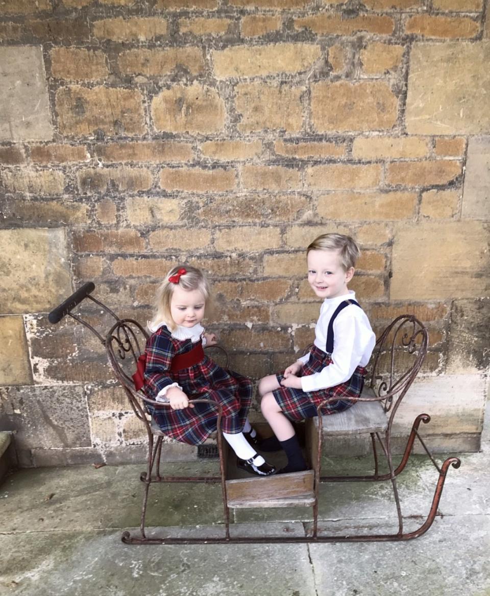 The little ones in their Amaia Christmas outfits on our sleigh.