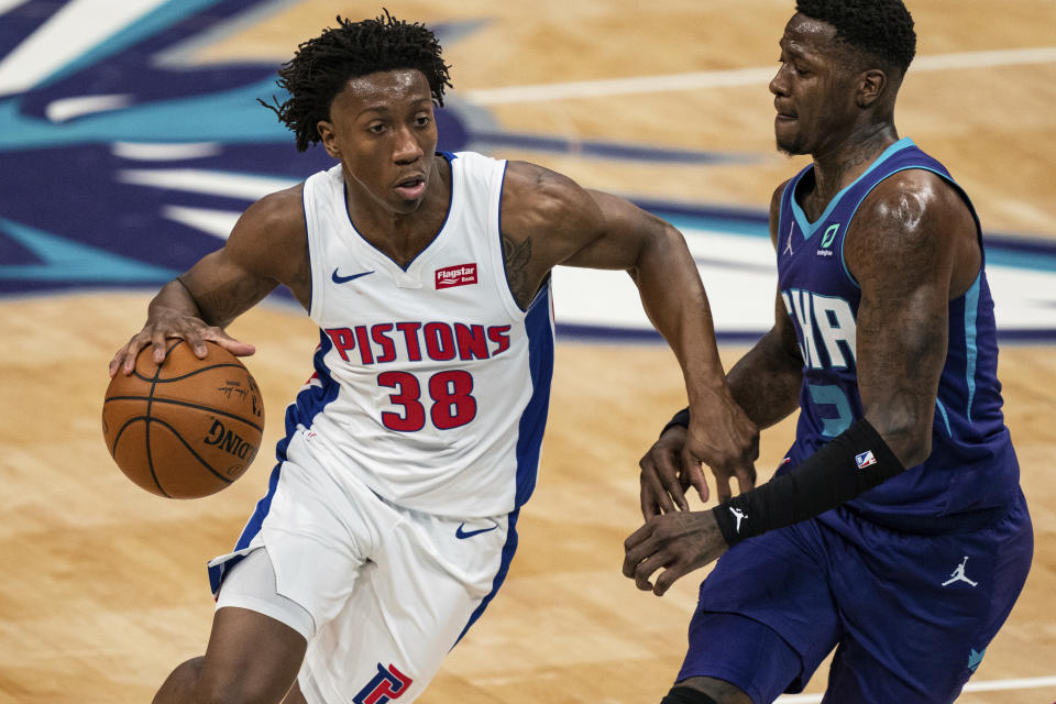 Detroit Pistons guard Saben Lee (38) drives while guarded by Charlotte Hornets guard Terry Rozier during the first half of an NBA basketball game in Charlotte, N.C., Thursday, March 11, 2021. (AP Photo/Jacob Kupferman)