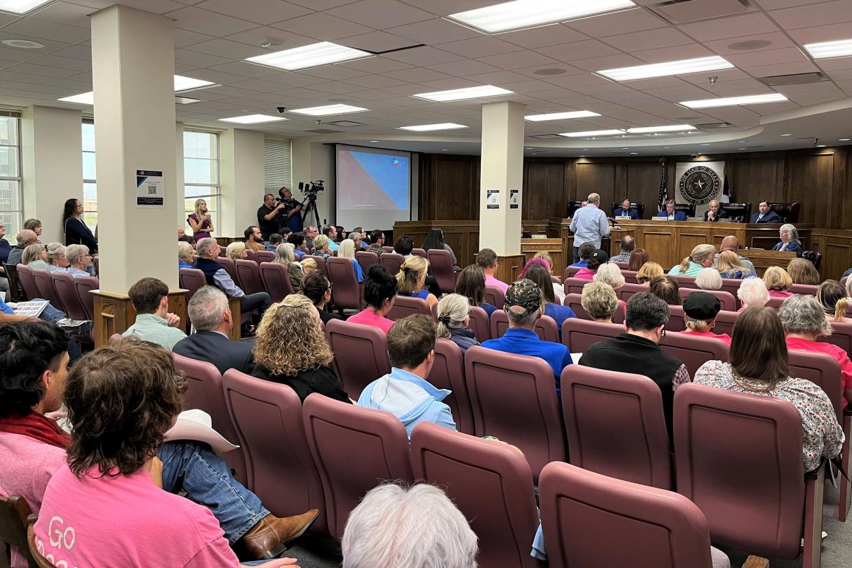 Lubbock County commissioners listen to public comment during a meeting Monday, Oct. 23, 2023.