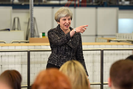 Britain's Prime Minister, Theresa May, addresses staff at a GlaxoSmithKline toothpaste factory in Maidenhead, April 21, 2017. REUTERS/Leon Neal/Pool