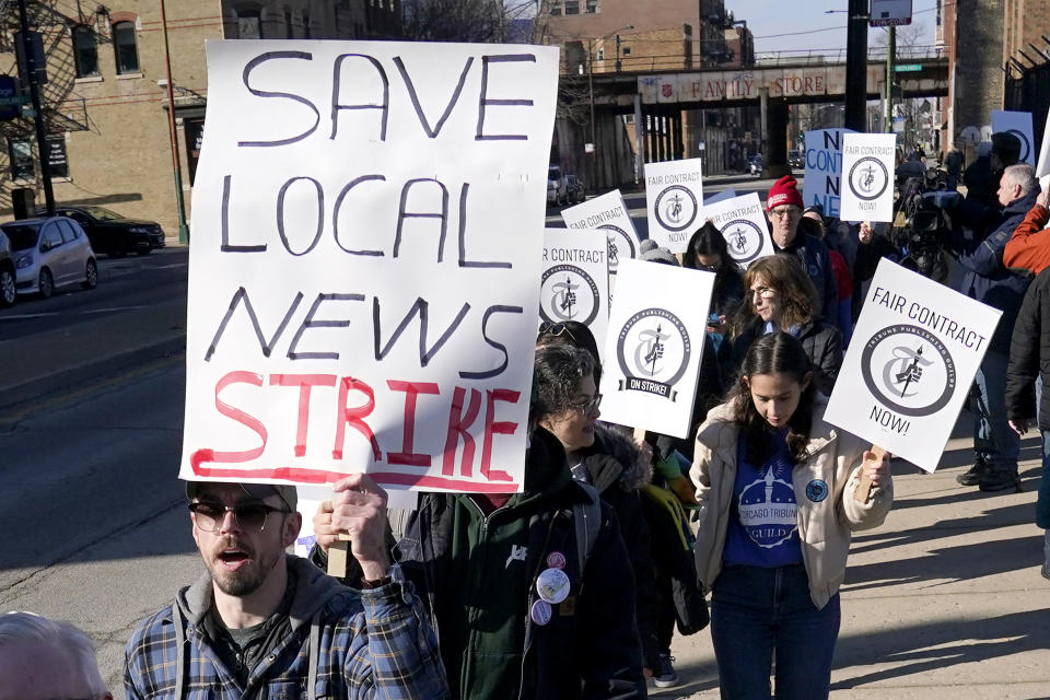 FILE - Chicago Tribune newsroom employees picket outside the newspapers Freedom Center newsroom and printing plant Thursday, Feb. 1, 2024, in Chicago. The Chicago Tribune is being sued, Thursday, May 16, by some of its staffers, who say they and other women and Black journalists are being paid less than their white male counterparts. (AP Photo/Charles Rex Arbogast, File)