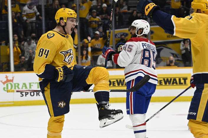 Nashville Predators left wing Tanner Jeannot (84) celebrates after scoring a goal against the Montreal Canadiens during the second period of an NHL hockey game Saturday, Dec. 4, 2021, in Nashville, Tenn. (AP Photo/Mark Zaleski)