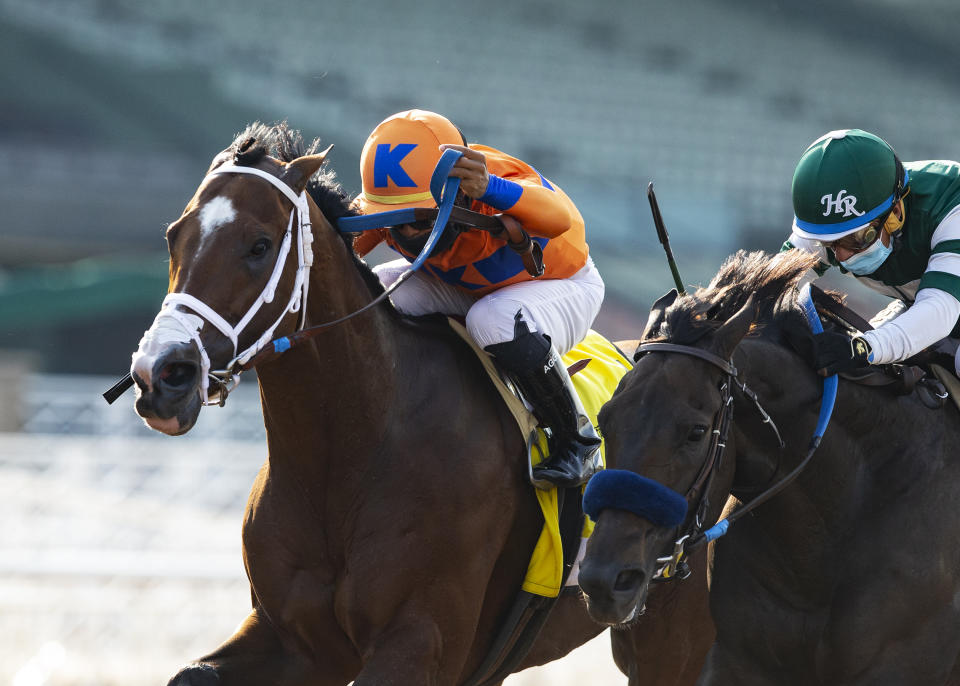 In a photo provided by Benoit Photo, C Z Rocket and jockey Luis Saez, outside, overpower Flagstaff (Victor Espinoza), inside, to win the Grade II, $200,000 Santa Anita Sprint Championship, Sunday, Sept. 27, 2020 at Santa Anita Park in Arcadia Calif.(Benoit Photo via AP)