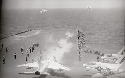 US navy jets take off from the deck of USS Constellation south-east of Saigon, on bombing missions during the Vietnam war, 1972 - Credit:  Bettmann