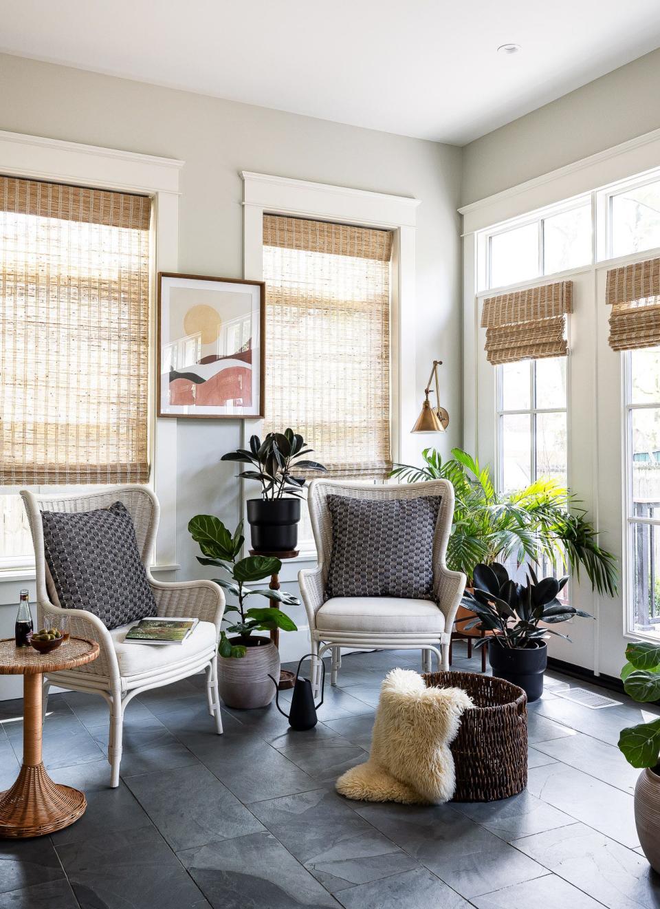 One end of the new dining room serves as a cozy reading nook at this renovated American Foursquare Craftsman home in Old Louisville.