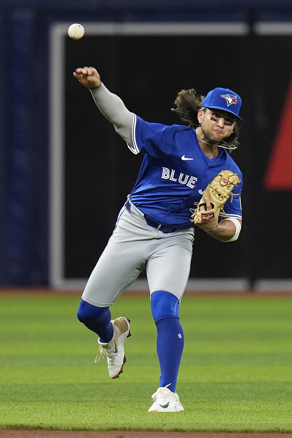 Toronto Blue Jays shortstop Bo Bichette makes a throwing error on a ground ball by Tampa Bay Rays' Yandy Diaz during the fifth inning of a baseball game Friday, March 29, 2024, in St. Petersburg, Fla. (AP Photo/Chris O'Meara)