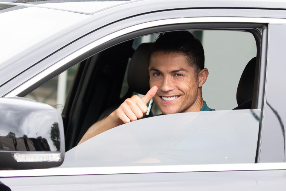 TURIN, ITALY - MAY 19: Juventus' Portuguese forward Cristiano Ronaldo exit in his car to resume training after a quarantine on May 19, 2020 at the club's Continassa training ground in Turin, as the country's lockdown is easing after over two months, aimed at curbing the spread of the COVID-19 infection, caused by the novel coronavirus. during the   Cristiano Ronaldo arrival at the Turin on May 19, 2020 in Turin Italy (Photo by Mattia Ozbot/Soccrates/Getty Images)