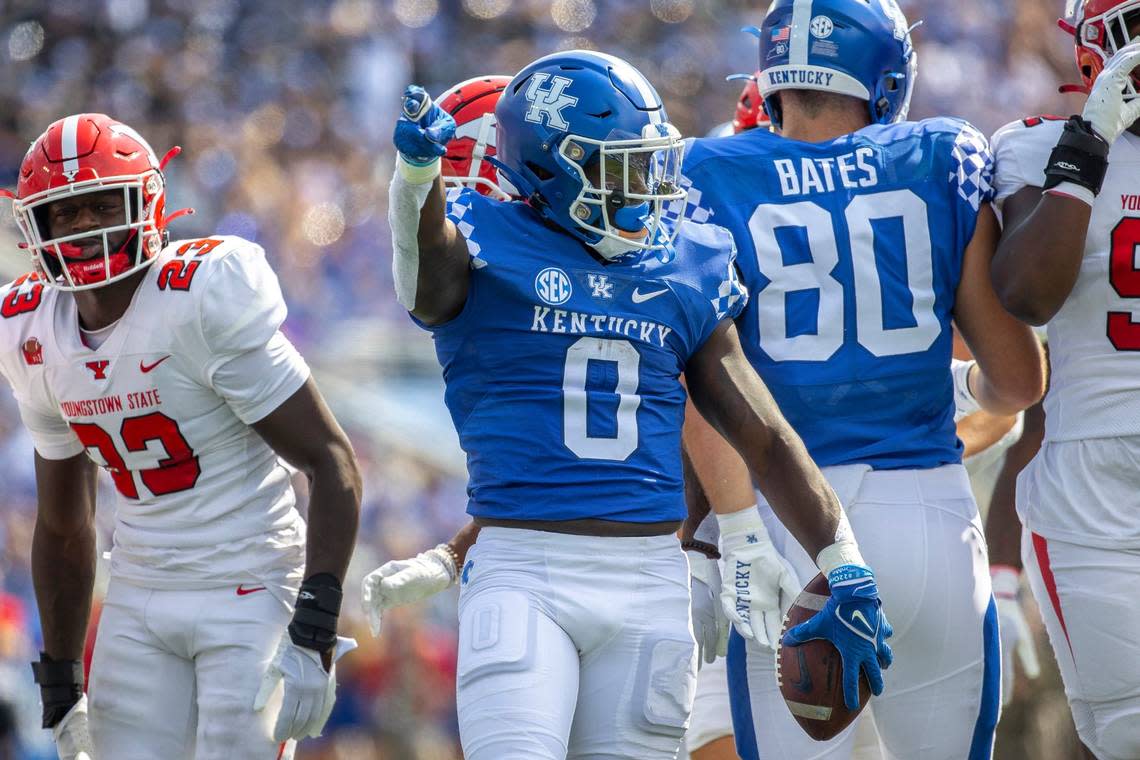 Kentucky running back Kavosiey Smoke (0) signals a first down during Saturday’s win. Smoke rushed 18 times for 66 yards and a touchdown.