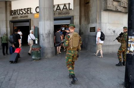 Belgian soldiers patrol outside Brussels central railway station after a suicide bomber was shot dead by troops in Brussels, Belgium, June 21, 2017. REUTERS/Francois Lenoir