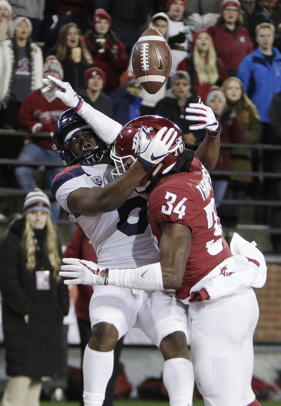 Washington State safety Jalen Thompson (34) disrupts a pass intended for Arizona wide receiver Shun Brown during the first half of an NCAA college football game in Pullman, Wash., Saturday, Nov. 17, 2018. (AP Photo/Young Kwak)