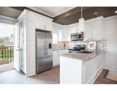 <p><span>4333 Knight St., Vancouver, B.C.</span><br> The kitchen features stainless steel Samsung appliances and a Fisher & Paykel fridge.<br> (Photo: Zoocasa) </p>