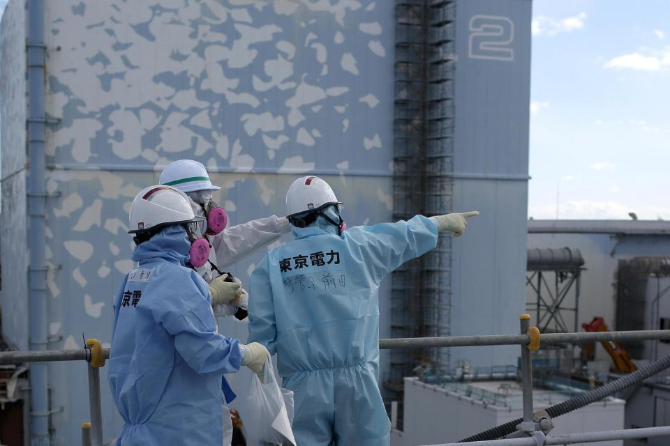 Earthquake: The quake hit just 200 miles east of the Fukushima nuclear plant (workers pictured in file photo): Getty Images