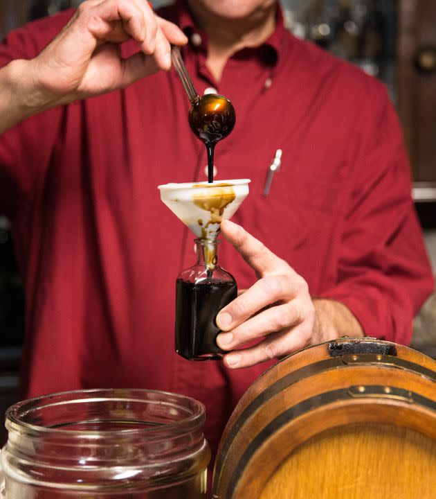 Balsamic vinegar of Modena is bottled in a traditional acetaia, where it is aged. (Photo: REDA&CO via Getty Images)