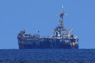 FILE - A dilapidated but still active Philippine Navy ship BRP Sierra Madre sits at the Second Thomas Shoal, locally known as Ayungin Shoal, at the disputed South China Sea on Aug. 22, 2023. The United States renewed a warning Tuesday, June 18, 2024 that it’s obligated to defend its close treaty ally a day after Filipino navy personnel were injured and their supply boats damaged in one of the most serious confrontations between the Philippines and China in a disputed shoal in the South China Sea, officials said. (AP Photo/Aaron Favila, File)