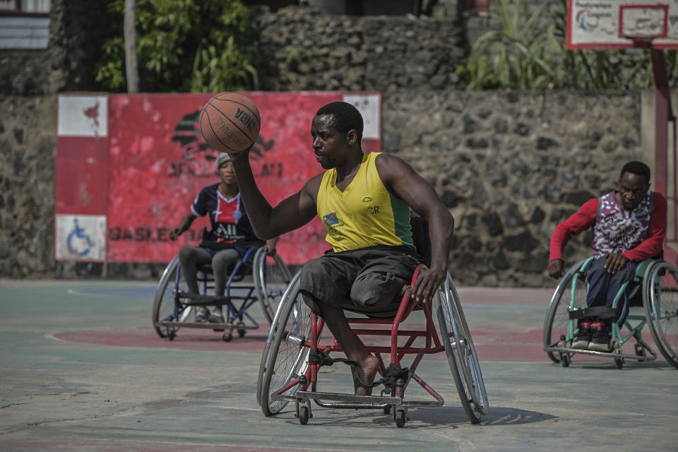 Paul Mitemberezi, a market vendor who has been disabled since he was 3 because of polio, plays basketball at the North Kivu Paralympic League, in Goma, democratic Republic of Congo, Tuesday Jan. 17, 2023. When Pope Francis arrives in Congo and South Sudan Jan. 31, thousands of people will take special note of a gesture more grounded than the sign of the cross. Watching from their wheelchairs, they will relate to the way he uses his. (AP Photo/Moses Sawasawa)