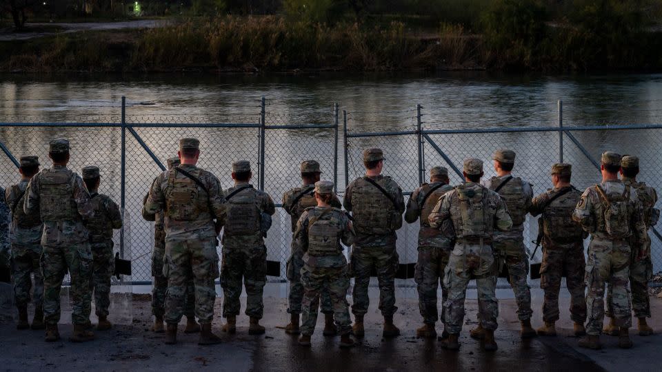 National Guard soldiers stand guard Friday on the banks of the Rio Grande at Shelby Park in Eagle Pass, Texas. - Brandon Bell/Getty Images