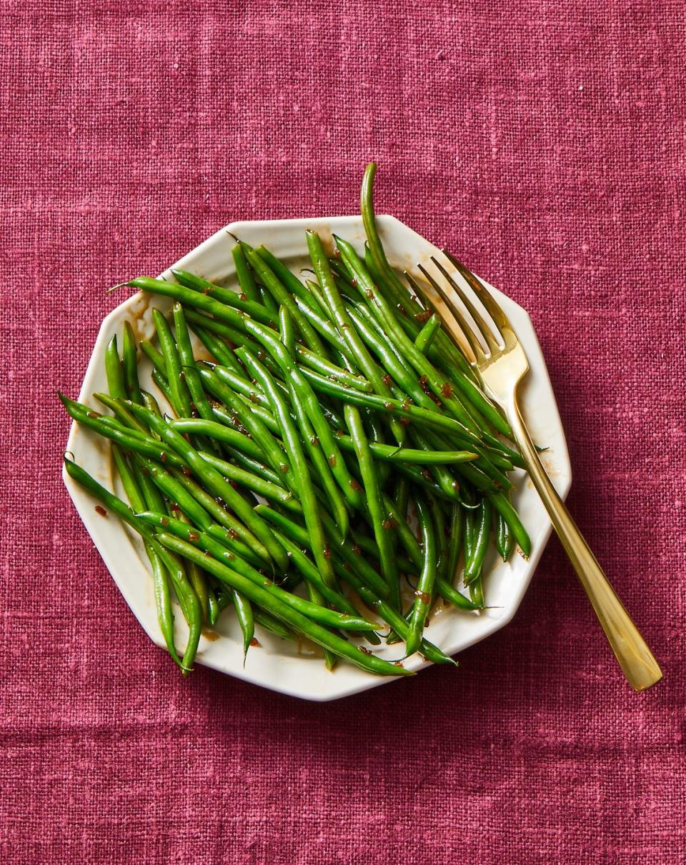 <p>Sherry wine and vinegar simmered with brown sugar creates a sweet-sour glaze for fresh green beans.</p><p><em><a href="https://www.goodhousekeeping.com/food-recipes/a34349776/glazed-green-beans-recipe/" rel="nofollow noopener" target="_blank" data-ylk="slk:Get the recipe for Glazed Green Beans »;elm:context_link;itc:0;sec:content-canvas" class="link ">Get the recipe for Glazed Green Beans »</a></em></p><p><strong>RELATED: </strong><a href="https://www.goodhousekeeping.com/holidays/thanksgiving-ideas/g803/green-beans/" rel="nofollow noopener" target="_blank" data-ylk="slk:31 Green Bean Recipes For Thanksgiving That Will Make These Veggies the Life of the Party;elm:context_link;itc:0;sec:content-canvas" class="link ">31 Green Bean Recipes For Thanksgiving That Will Make These Veggies the Life of the Party</a></p>