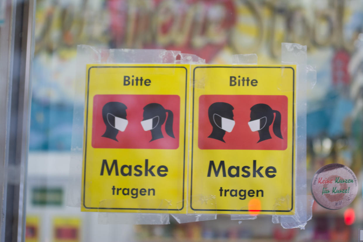 mask signs are seen in a shop a day before carnival session opening in Cologne, Germany on November 10, 2020.   Due to the coronavirus outbreak, no official celebrations this year around and also no also ban on alcohol consumption and restrict group gathering. (Photo by Ying Tang/NurPhoto via Getty Images)