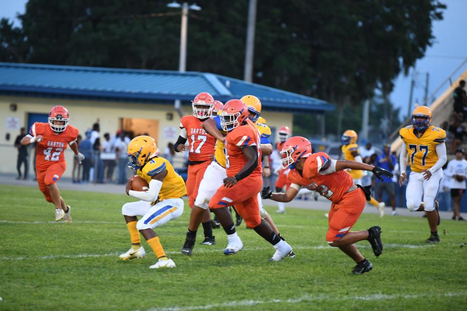 Bartow's Quavion Bird chases down Auburndale's Jerrod Johnson in a spring jamboree game. Bird had a huge sack for loss and a fumble recovery touchdown in the contest.